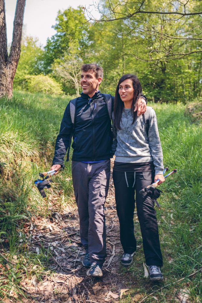 Hikers walking embraced
