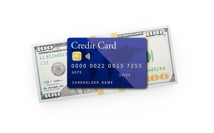 Ten Thousand Dollars Stack of One Hundred Dollar Bills with a Credit Card on Top