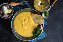 Top view French onion cream soup served with wine