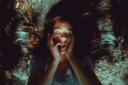 Woman lying on ground