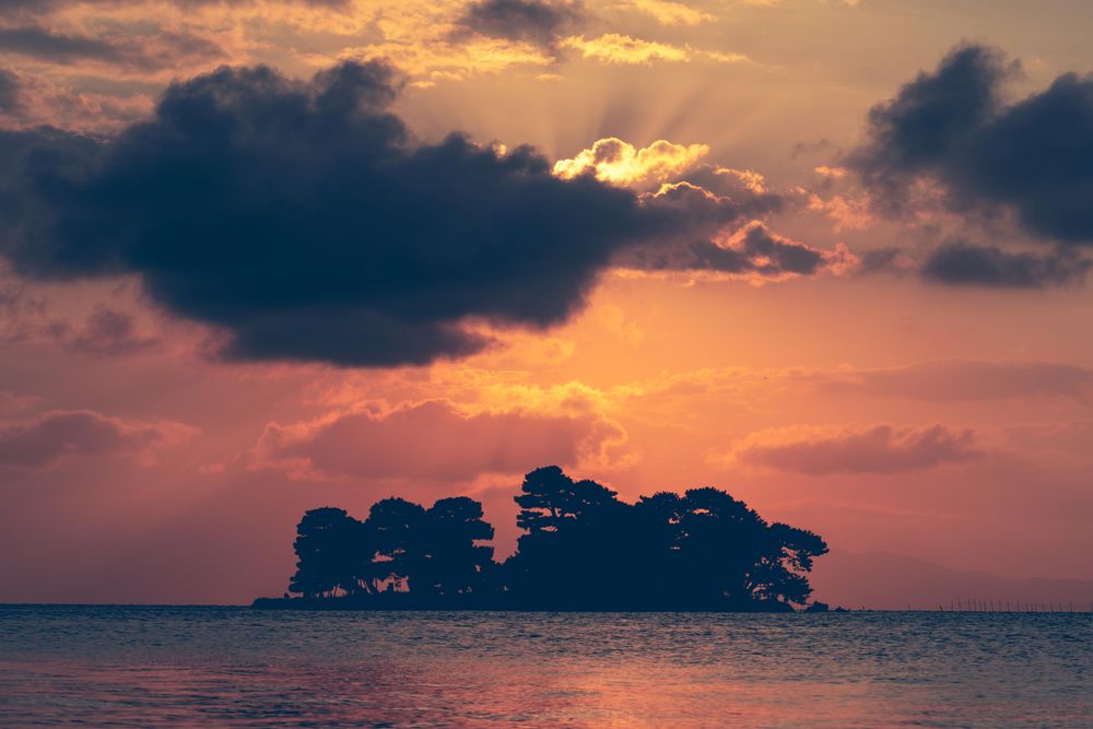 Colorful sunset behind a cloud