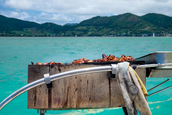 Barbecuing meat on the ocean