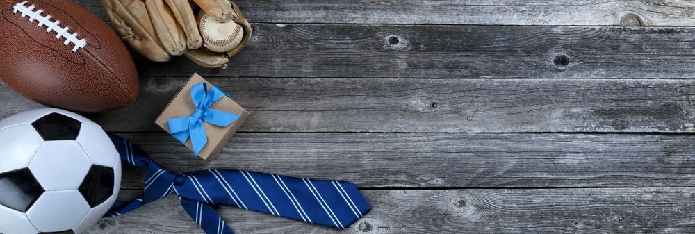 Father’s day with ball sport gifts on old wood table