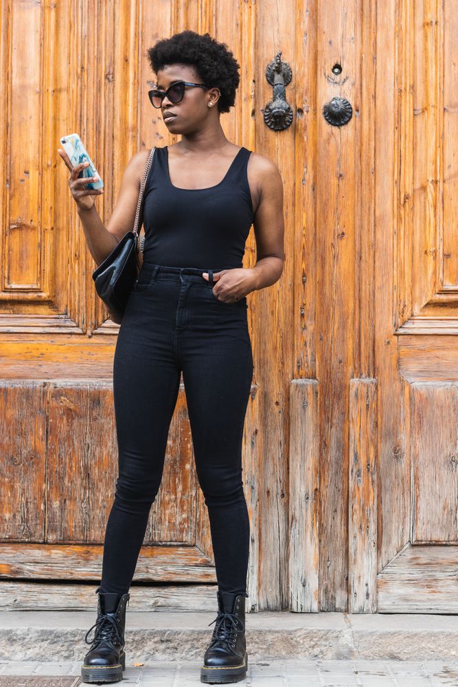 Black woman chatting on smartphone