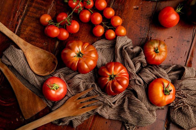 Tomatoes and napkins on wooden table