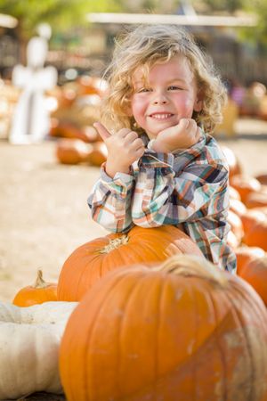 Cute Little Boy Gives Thumbs Up at Pumpkin Patch