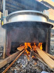 Boiling Yellow Soybeans in a Traditional Pot