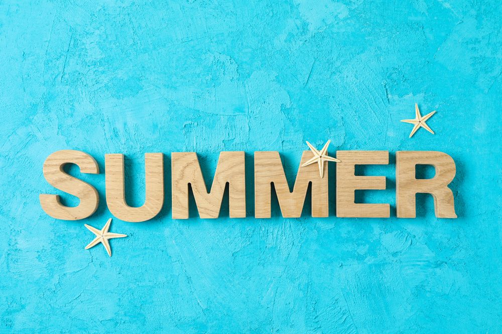 Inscription summer with starfishes on color background, space for text. Happy holidays