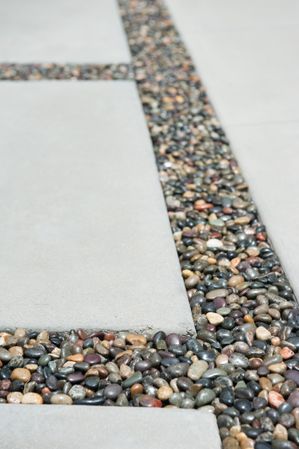 Three pavers and pebbles