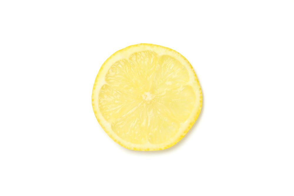 Lemons slice isolated on light background. Ripe fruit