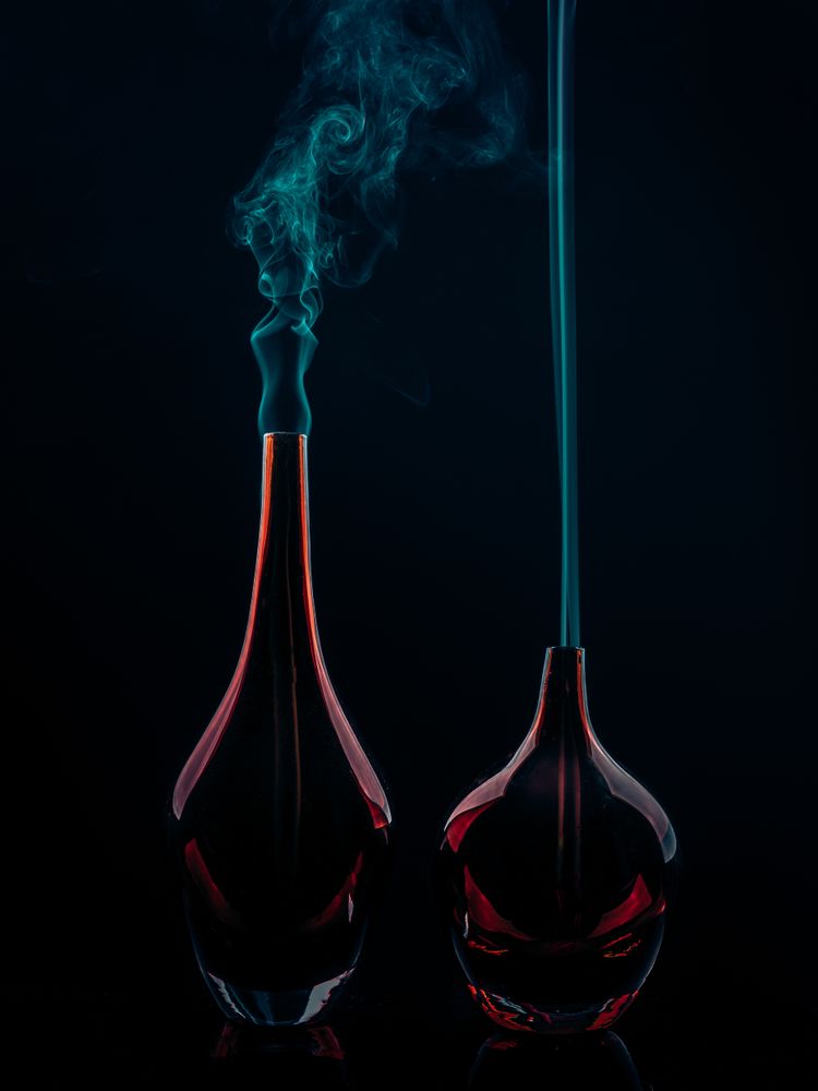 Glass bottles emitting smoke