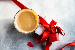 Top view of drink with present with red padlock