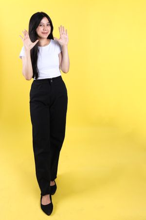 Excited Asian Indonesian Woman Wearing White Shirt Showing Five Hand Gesture