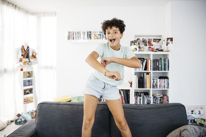 Girl dancing on a sofa