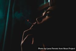 Moody shot of woman smoking 0vM2db
