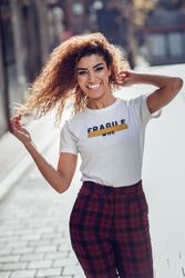 Smiling Arab woman with curly hair walking down sunny street playing with hair