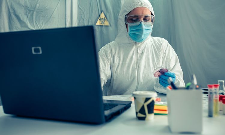 Scientist working with laptop in the laboratory