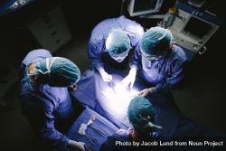 Top view shot of team of surgeons performing surgery in operation theater 43QLr0