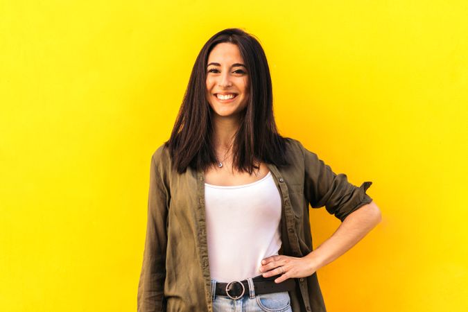 young woman portrait on a yellow background