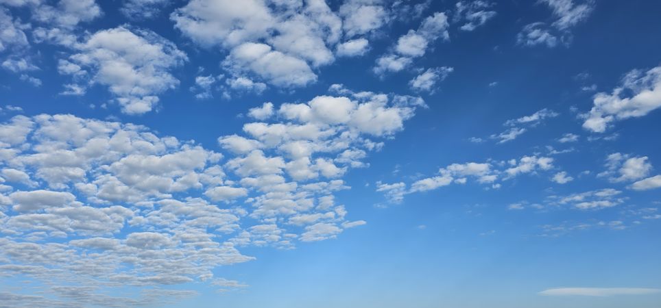 Blue sky with fluffy clouds
