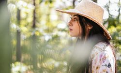 Woman enjoying a day in nature in the forest