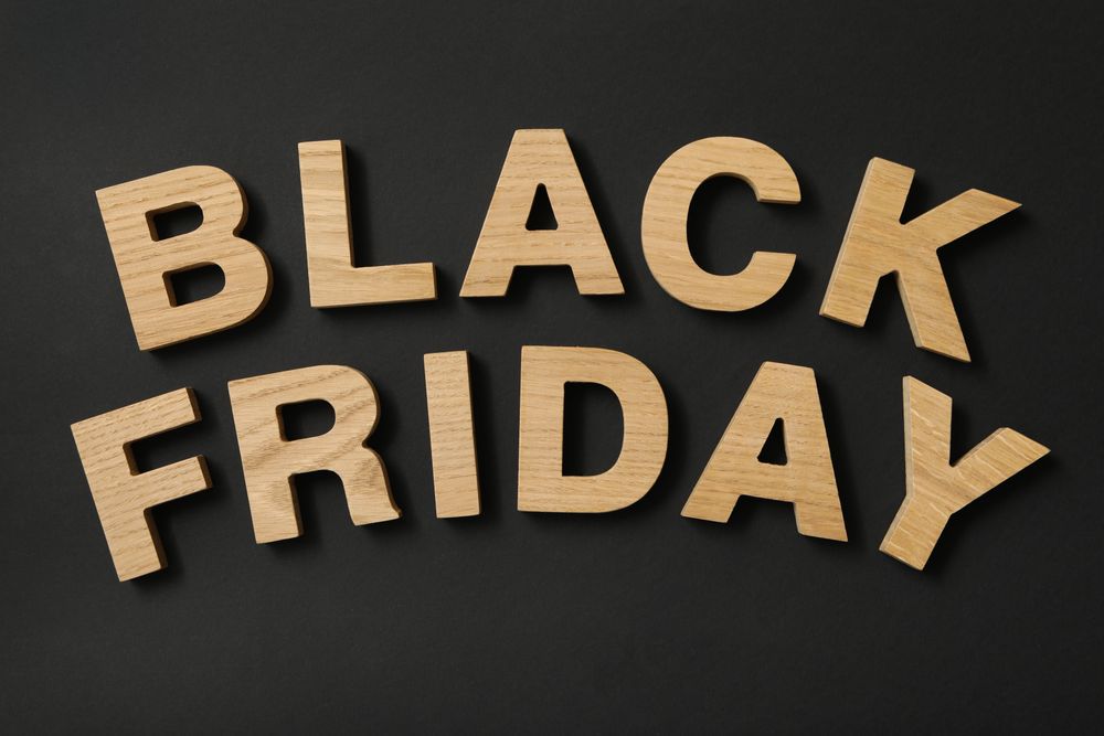 Text made of wooden letters on black background