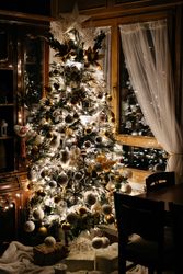 Bright Christmas tree in cozy room