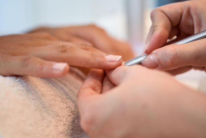 Woman having a manicure in salon