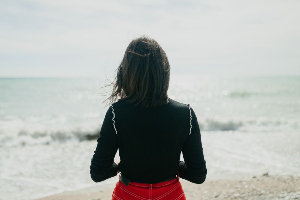 Anonymous female looking at sea