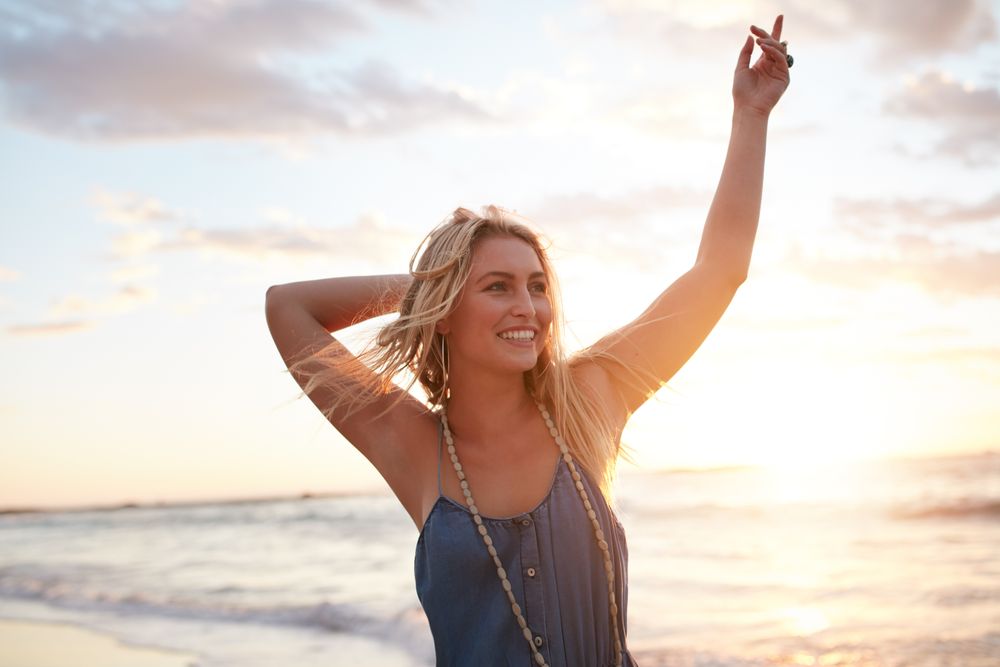 Portrait of attractive young woman enjoying on the beach at sunset - Free  Photo (be3jq5) - Noun Project