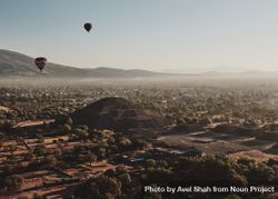 View of two hot air balloon in next to pyramid in Teotihuacan Valley 4moEQ0