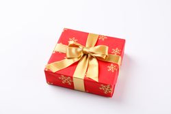 Beautiful gift box with golden bow on blank background, space for text