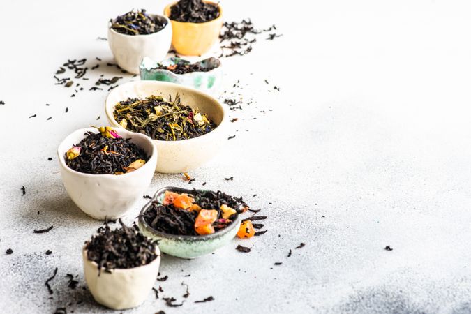 Tea varieties on stone background with space for text