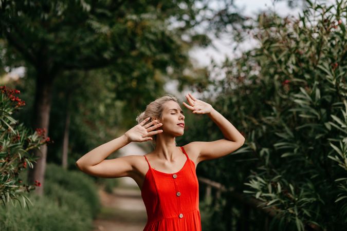 Dreamy young woman in summer garden