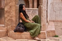 Woman on street between ancient buildings