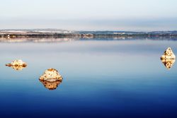 Beautiful lake with rocks in blue water