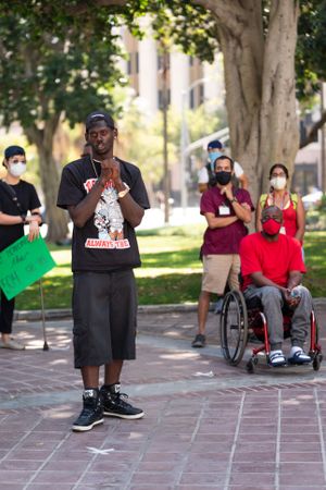 Los Angeles, CA, USA — June 16th, 2020: male speaker talks to group of people at protest rally