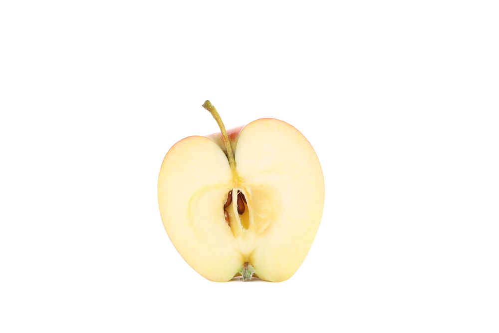 Half of red apple isolated on light background