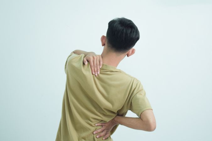 Asian young man feeling pain on his body