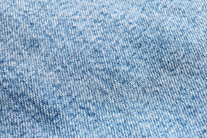 Texture of blue jeans as background, space for text