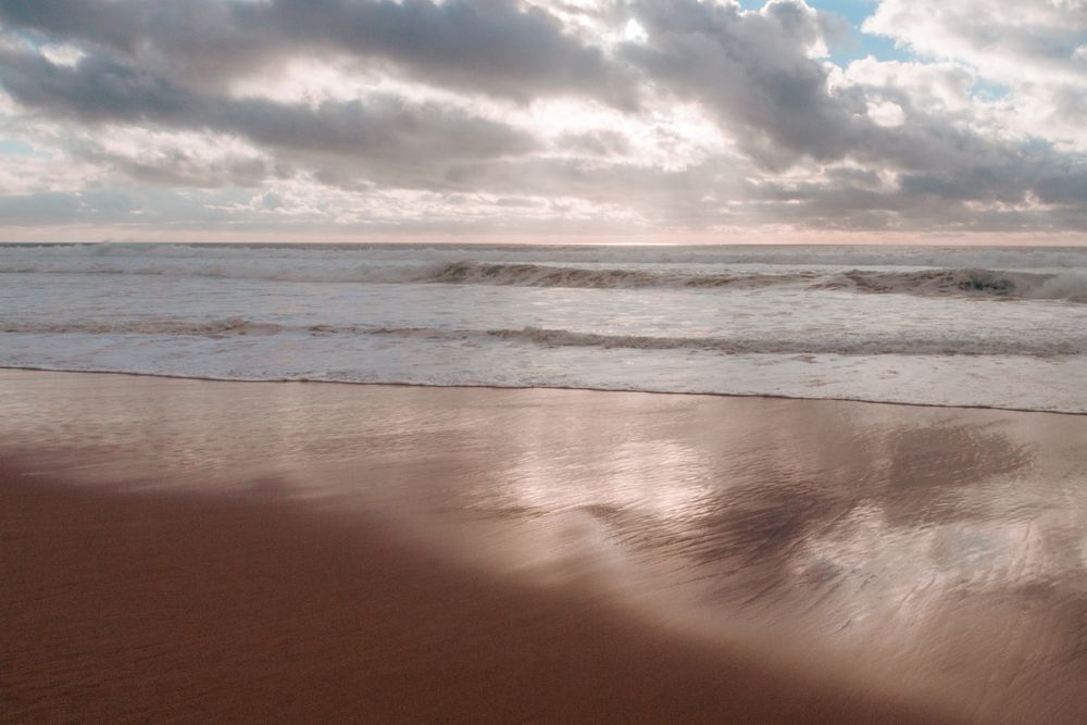Waves coming in on quiet beach in the morning