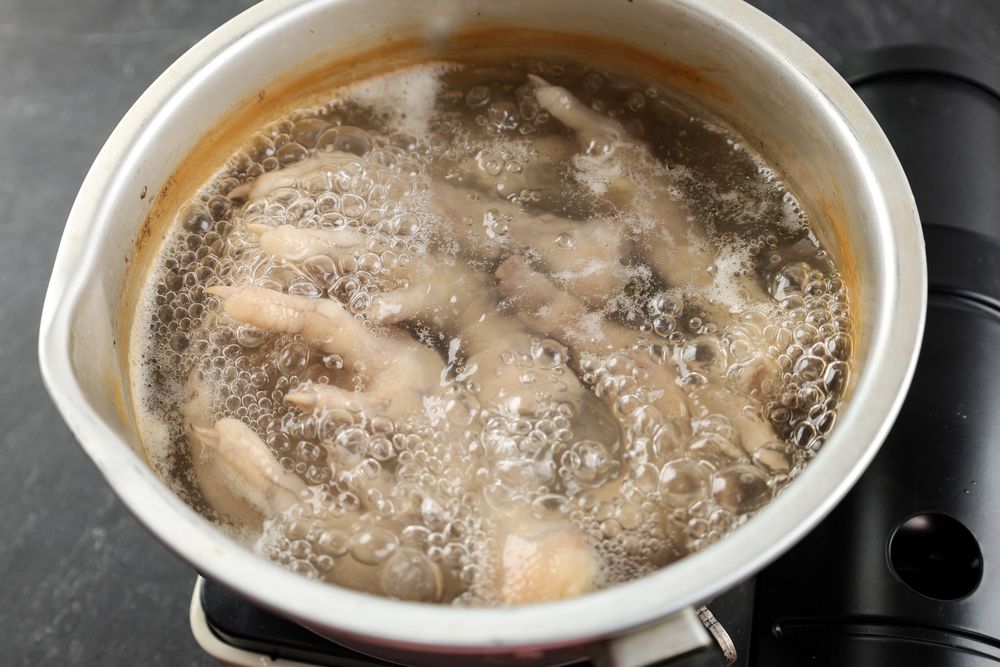 Boiling Chicken Feet in an Aluminum Pan