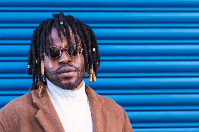 Black man in trendy sunglasses in city