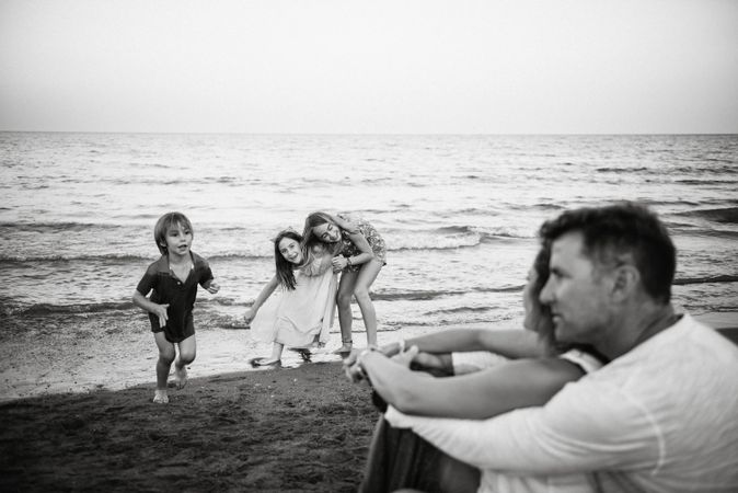 Beautiful happy family with children on beach