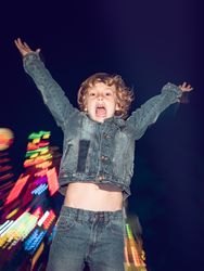 Playful boy in amusement park