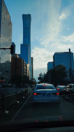 Cars on road near high rise buildings in Beijing, China