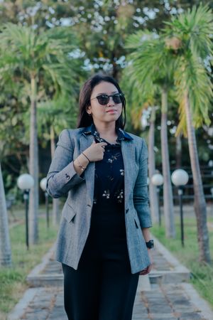 Confident businesswoman embodying professional style in tropical