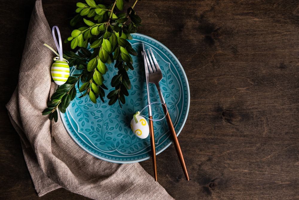 Top view of blue plate with eggs for spring table setting
