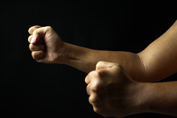 male hand fist on dark background