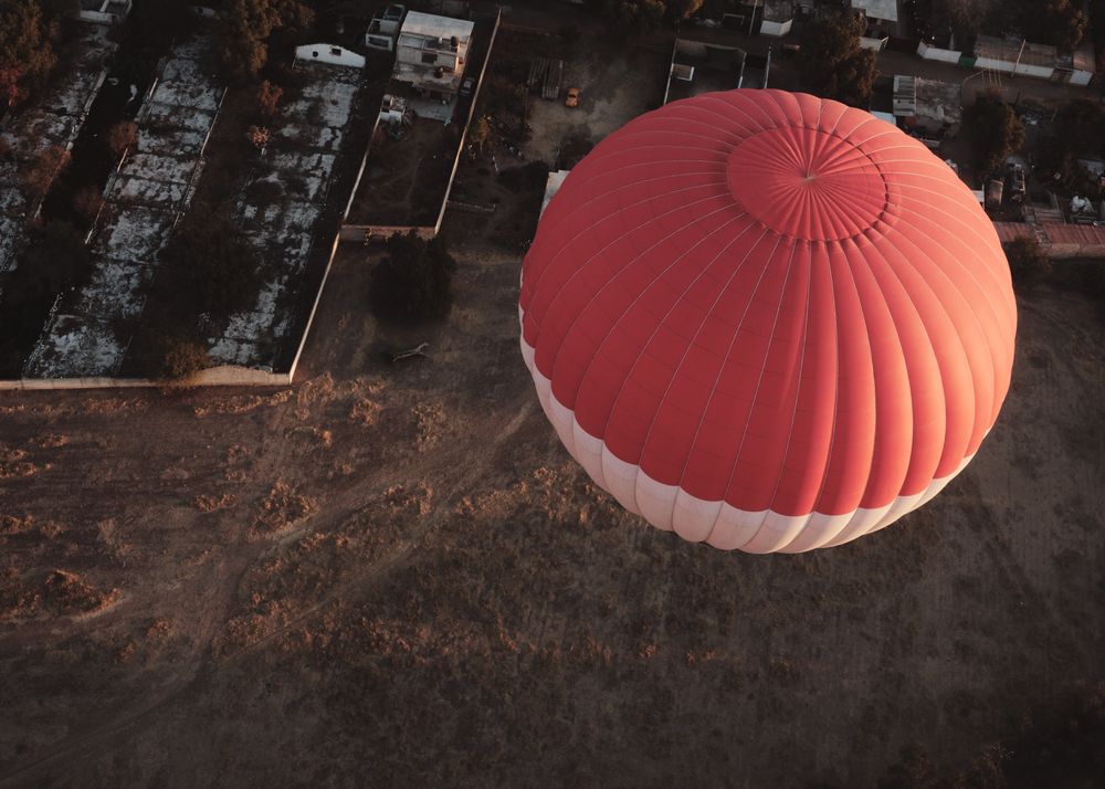 Looking down at hot air balloon in flight over Teotihuacan Valley